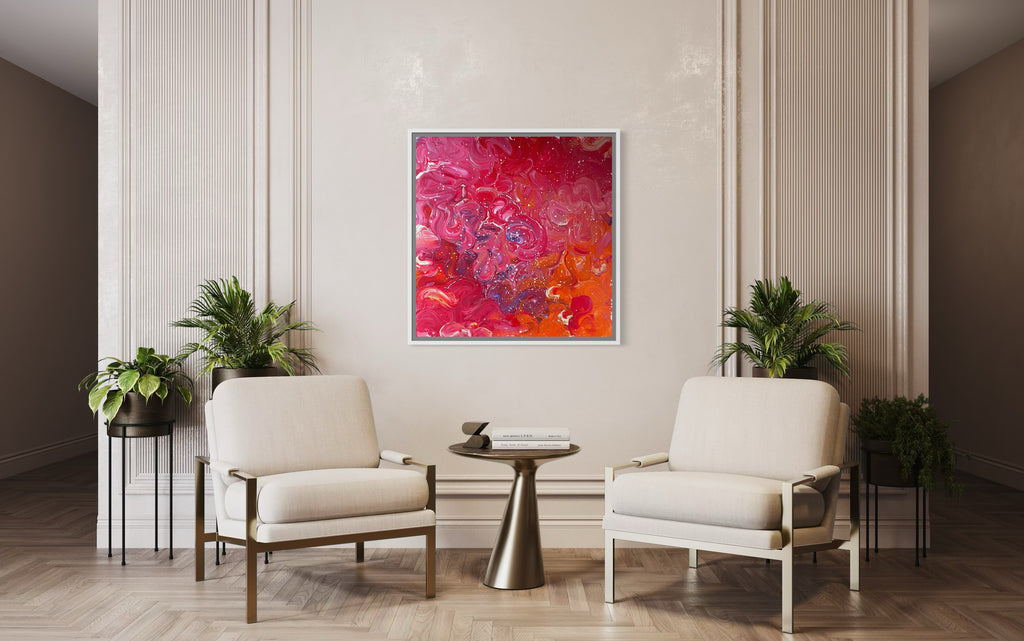 Modern living room with two chairs, a small table, and a colorful abstract painting on the wall.