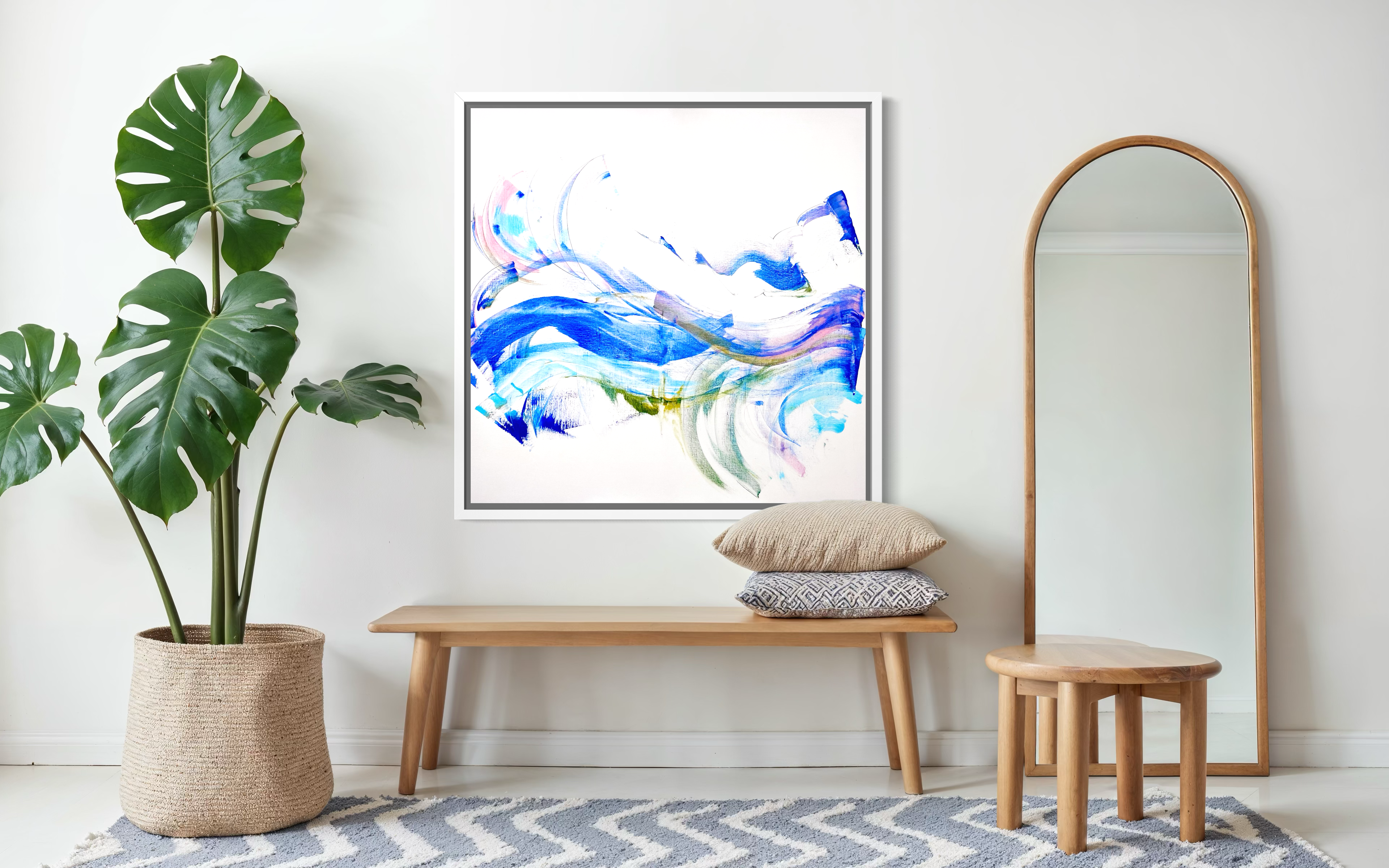 Modern interior with abstract art, plant, bench, and mirror.